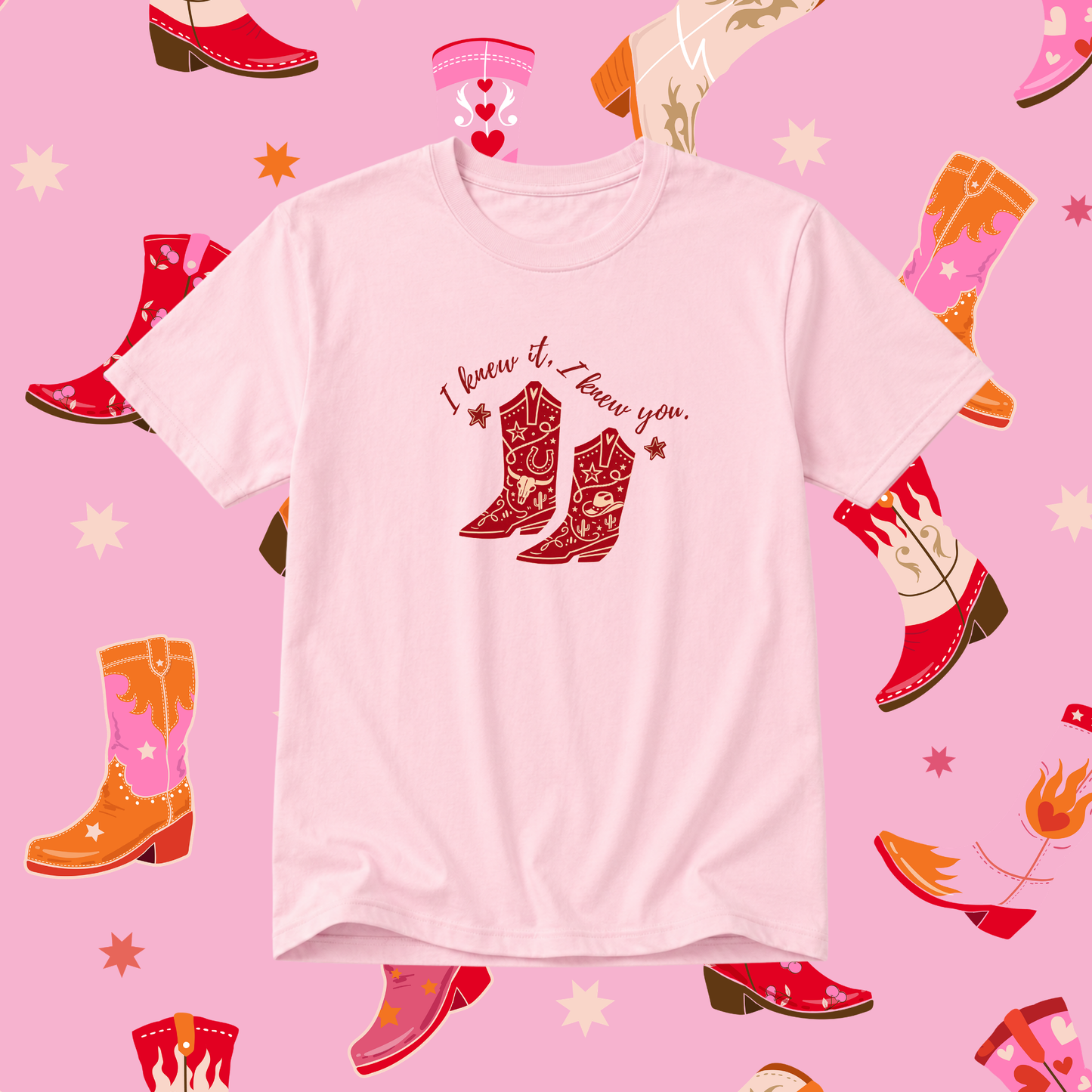 White t-shirt with cowboy boot design and text on a pink background with boot illustrations