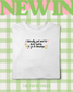 White t-shirt with bookshop and matcha slogan on a green and white checkered background with 'NEWIN' and 'The Paper Press' text.