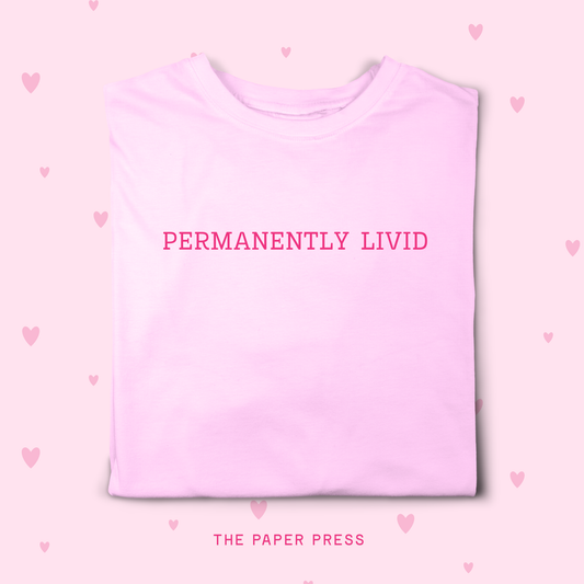 Pink t-shirt with 'PERMANENTLY LIVID' text on a pink background with heart shapes.