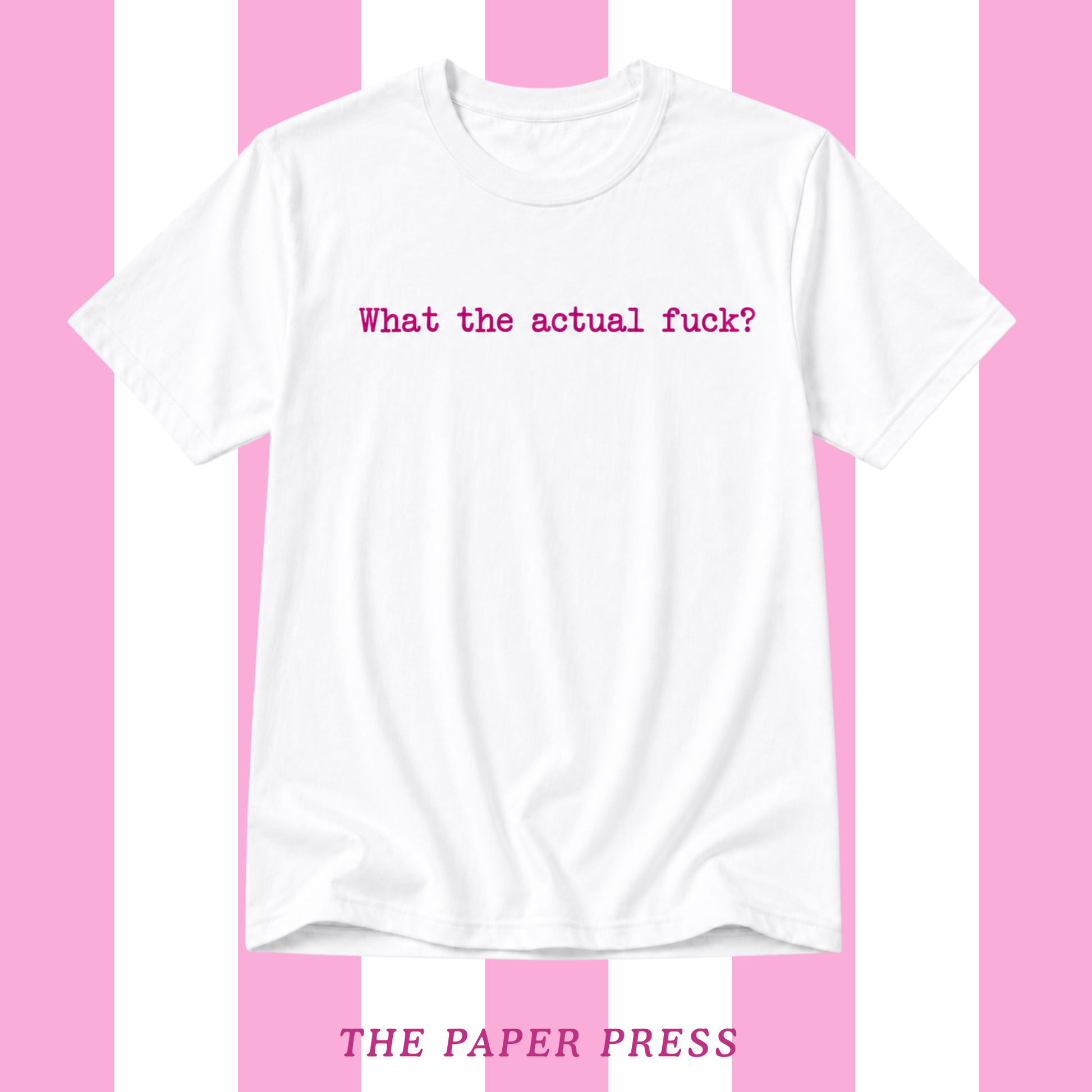 A white short-sleeve crewneck t-shirt with the phrase 'What the actual fuck?' printed in pink across the chest. The shirt is displayed against a pink and white vertically striped background, with 'THE PAPER PRESS' printed in pink at the bottom.