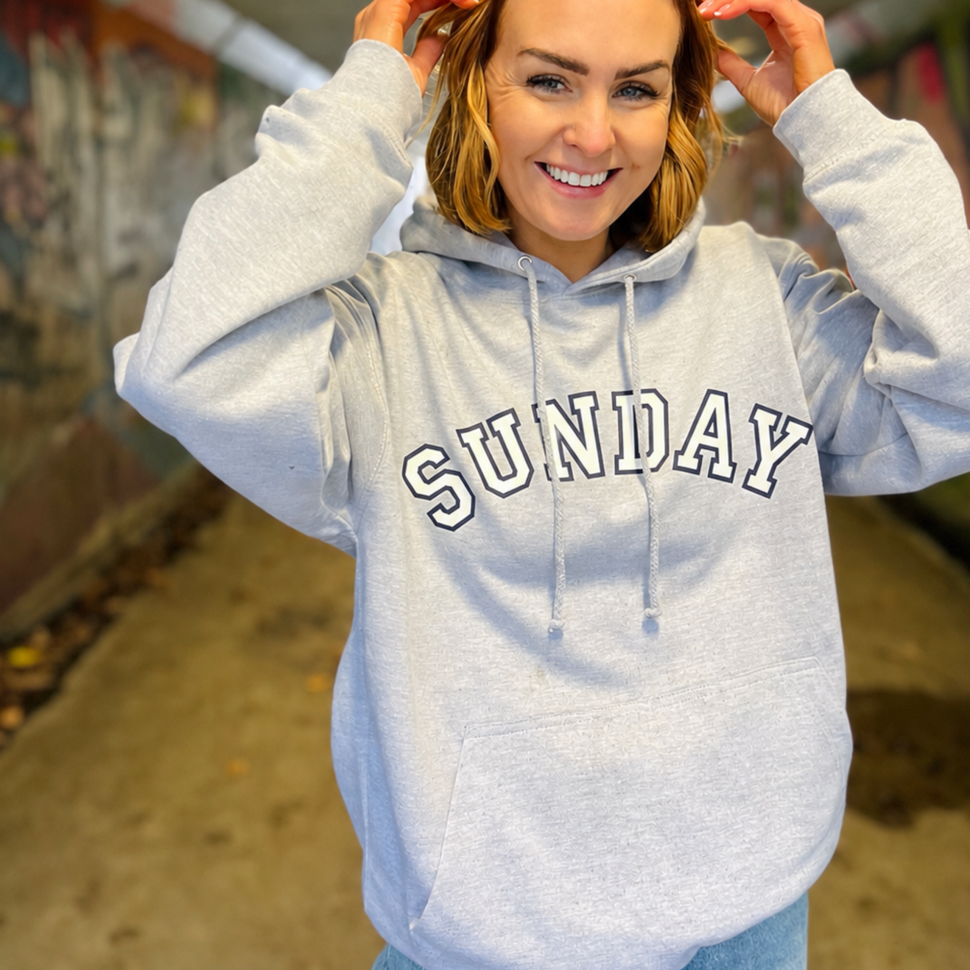 Sunday hoodie in light grey with varsity style print.  