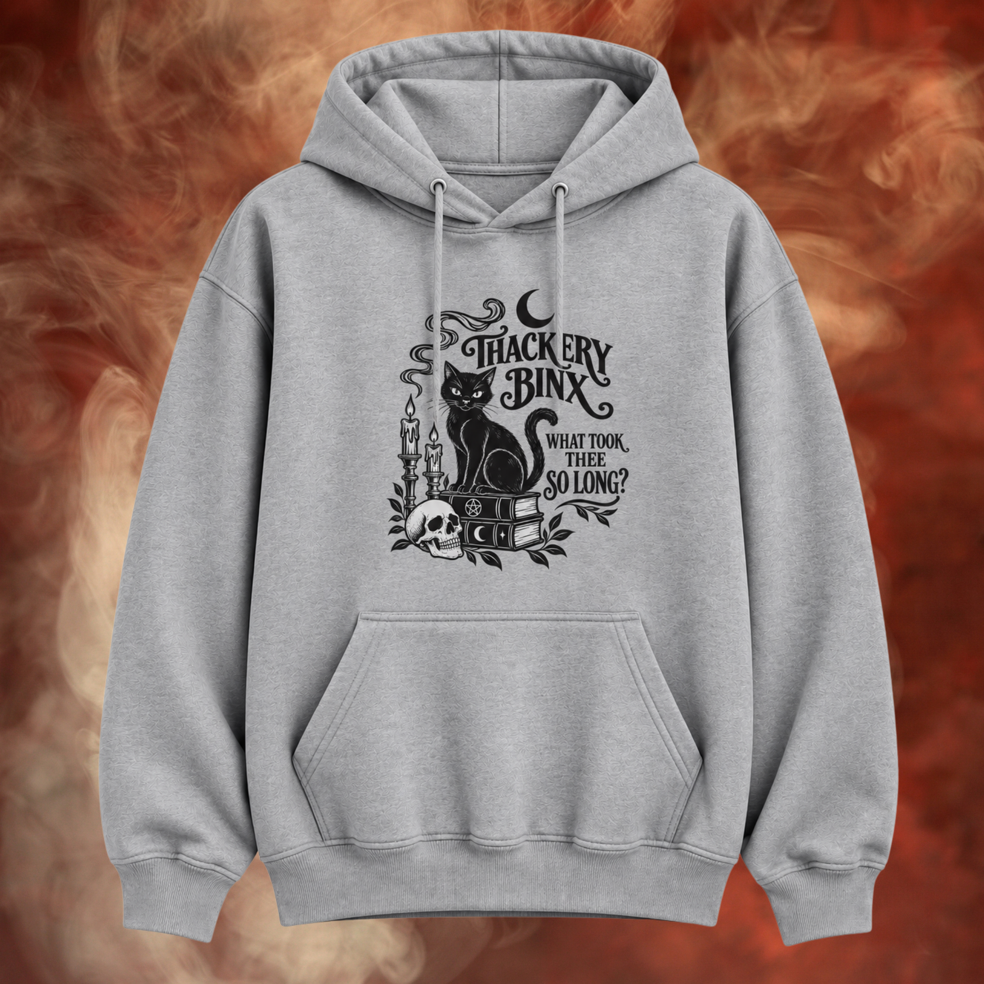 A light gray pullover hoodie with a black gothic-style graphic of a cat, candles, a skull, and the text 'Thackery Bink' and 'What Took, You, So Long?' on the front, shown against a smoky orange and red background.