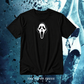 A black short-sleeve t-shirt featuring a white Ghostface mask graphic on the chest, displayed against a dark blue textured background with the text 'THE PAPER PRESS' at the bottom.