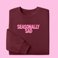SEASONALLY SAD SWEATER