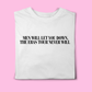 White t-shirt with black text reading “Men Will Let You Down, The Eras Tour Never Will”, folded flat on a pink background