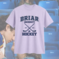 White t-shirt with 'Briar University Hockey' design on a blurred background